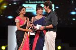 Priyamani receives the Best Actor - Female award for the movie Charulatha from Lakshmi Manchu and Jagapathy Babu during the 60th Filmfare Awards.jpg